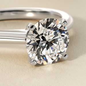 Petite Solitaire Engagement Ring in Platinum